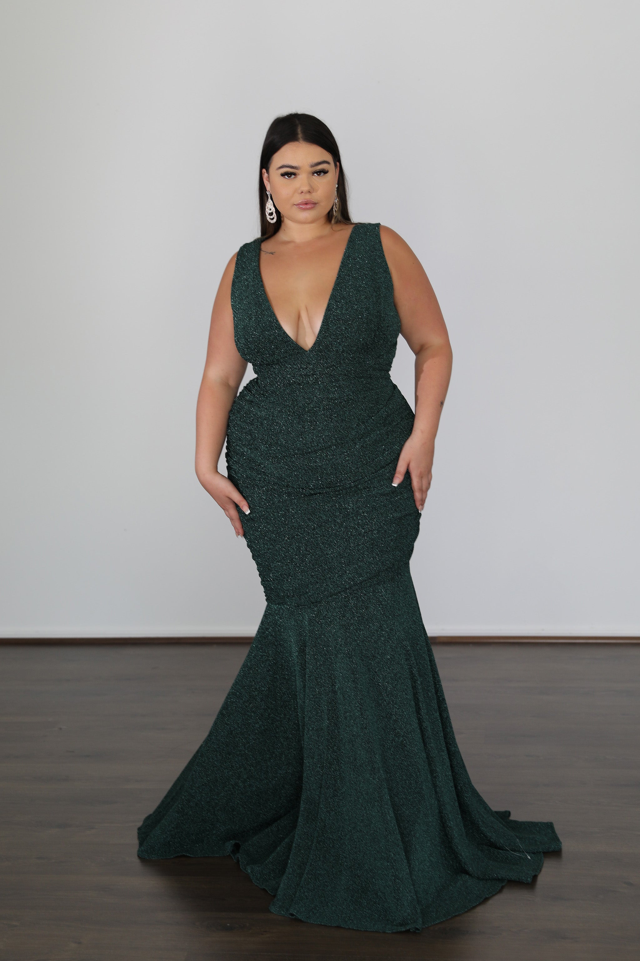 emerald green formal gown with v-neckline and mermaid skirt