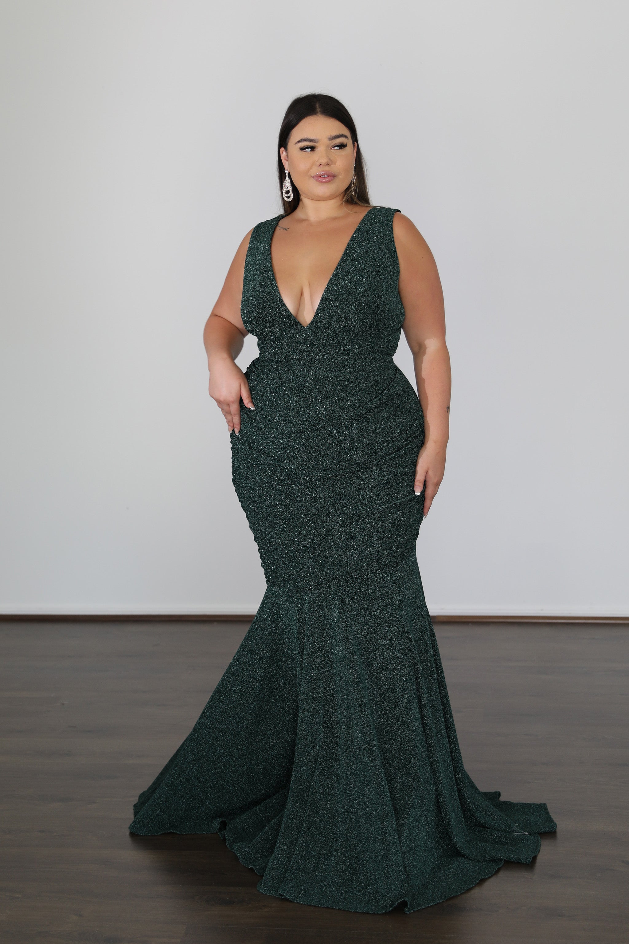 flattering v-neck emerald green formal gown with mermaid skirt and train