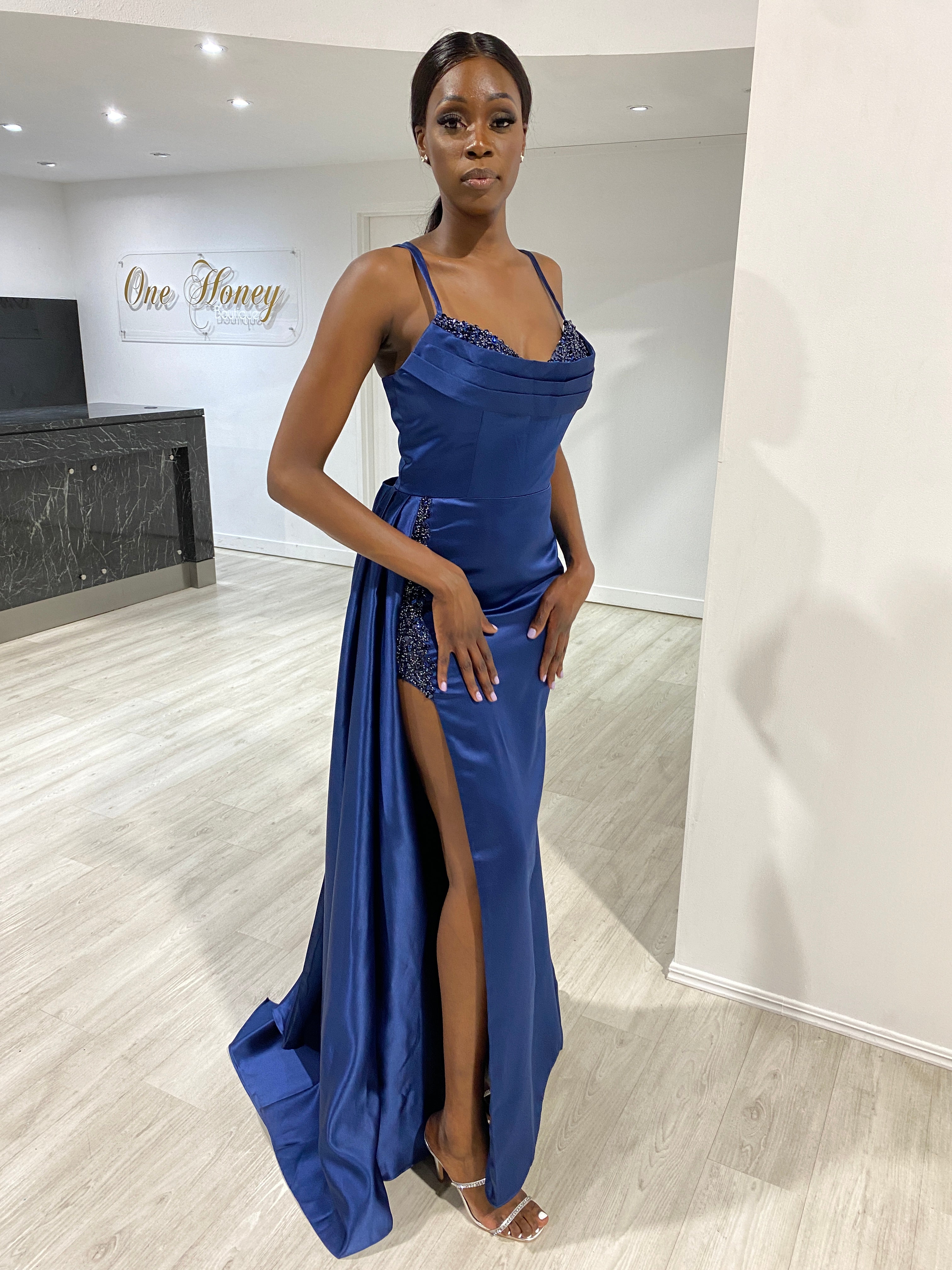 Navy blue dress shop on dark skin