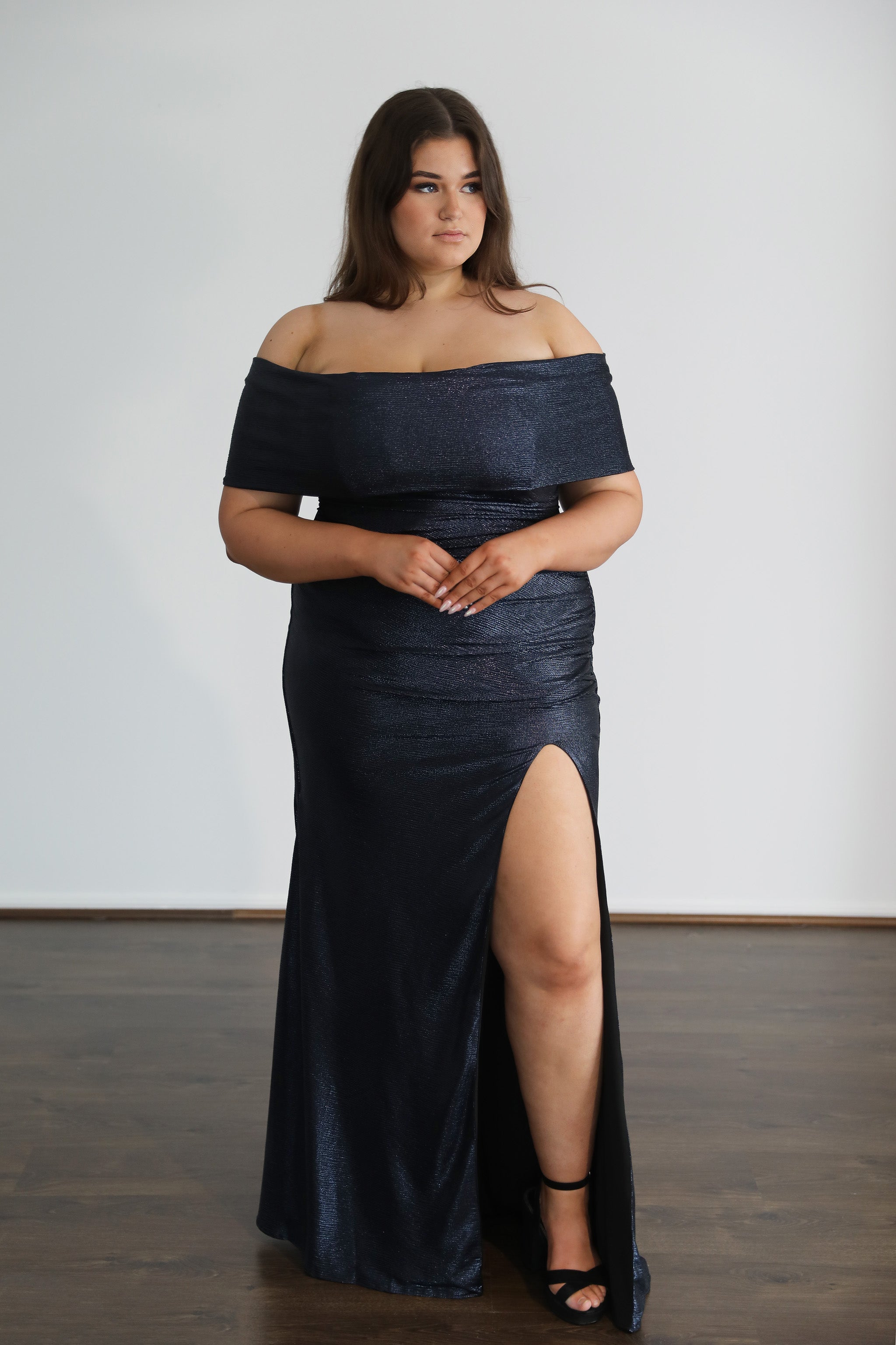 model posing in navy formal dress