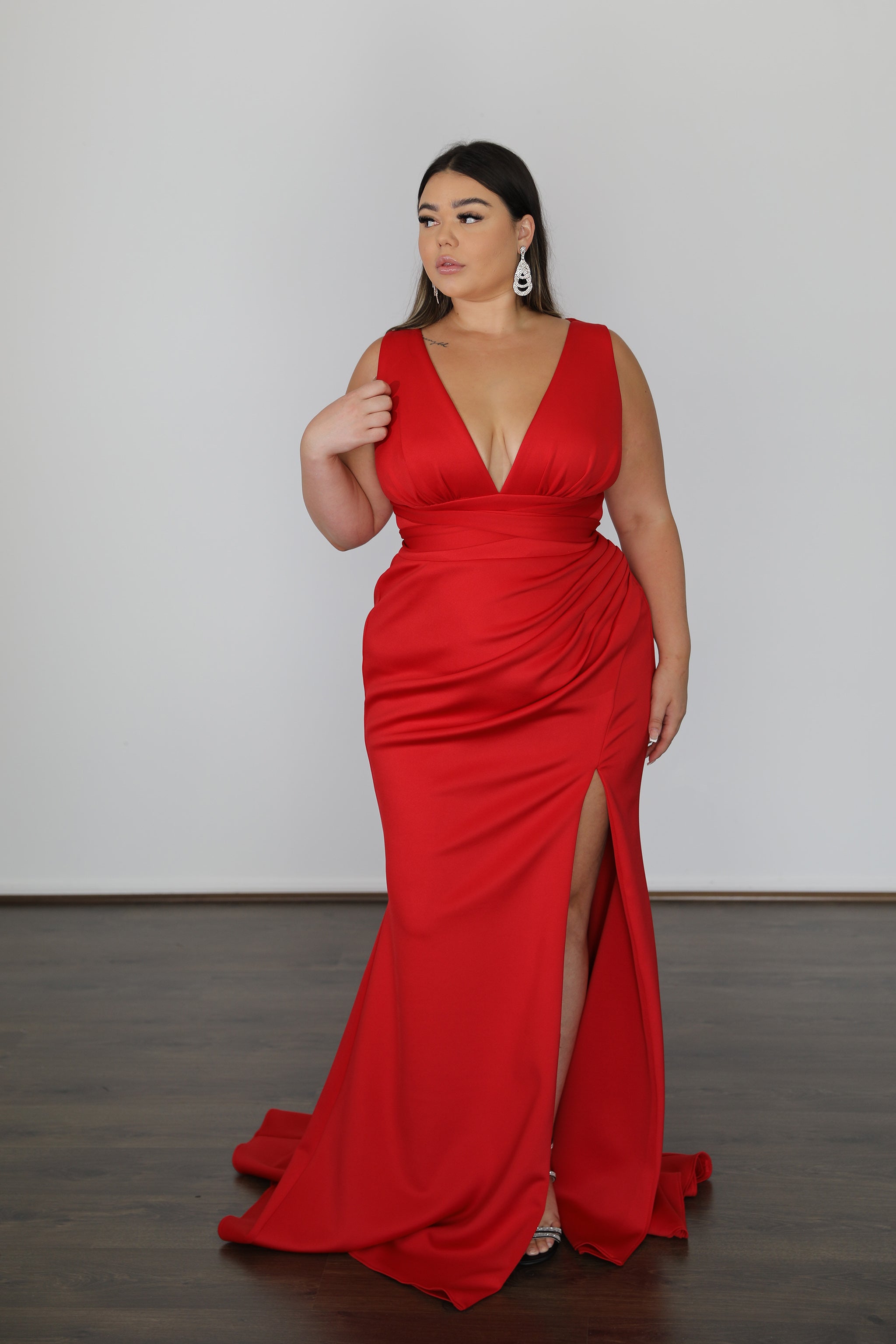 red v-neck formal gown with ruched skirt