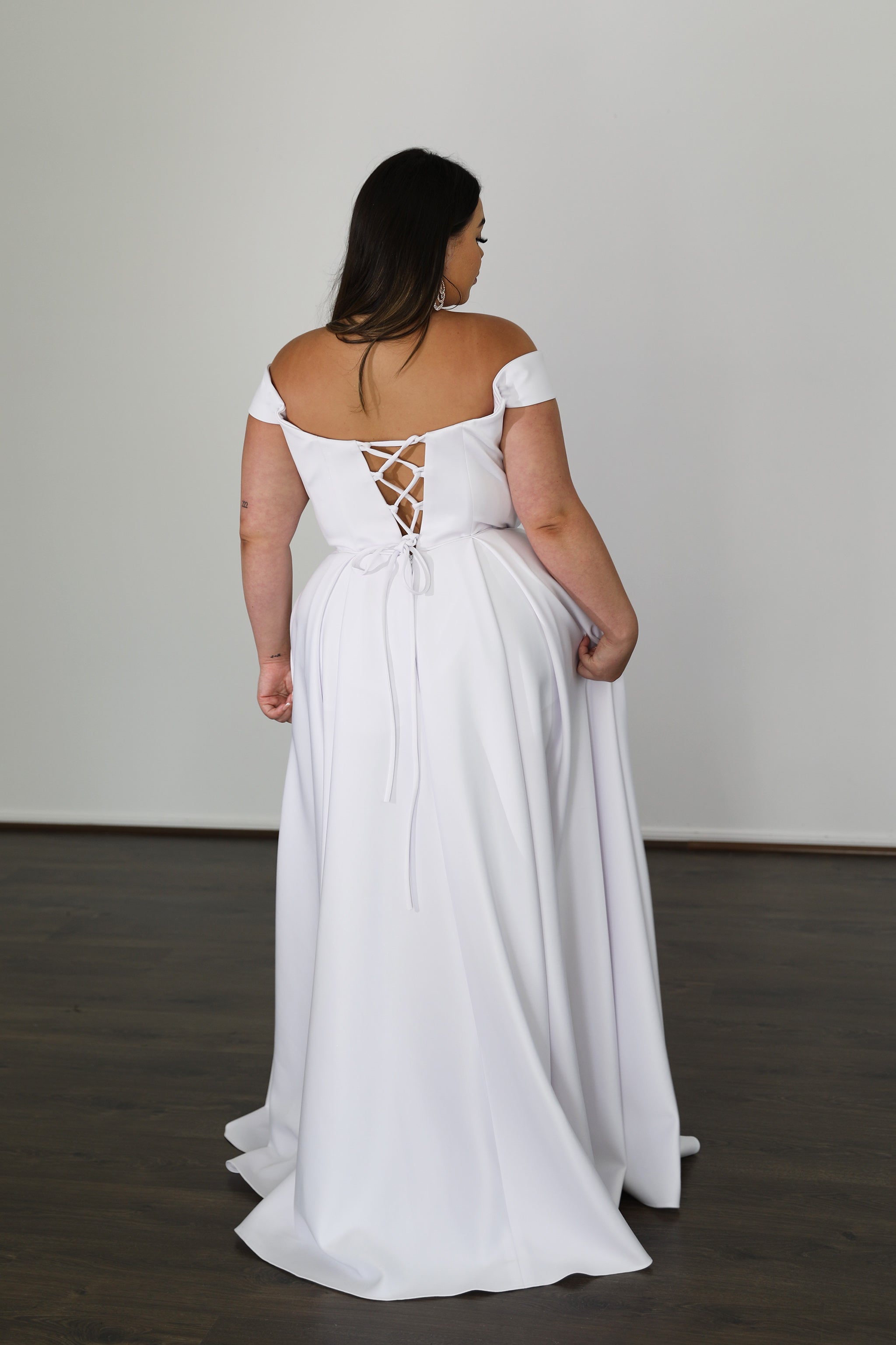 white dress with detachable sleeves and cross-over tie-up back