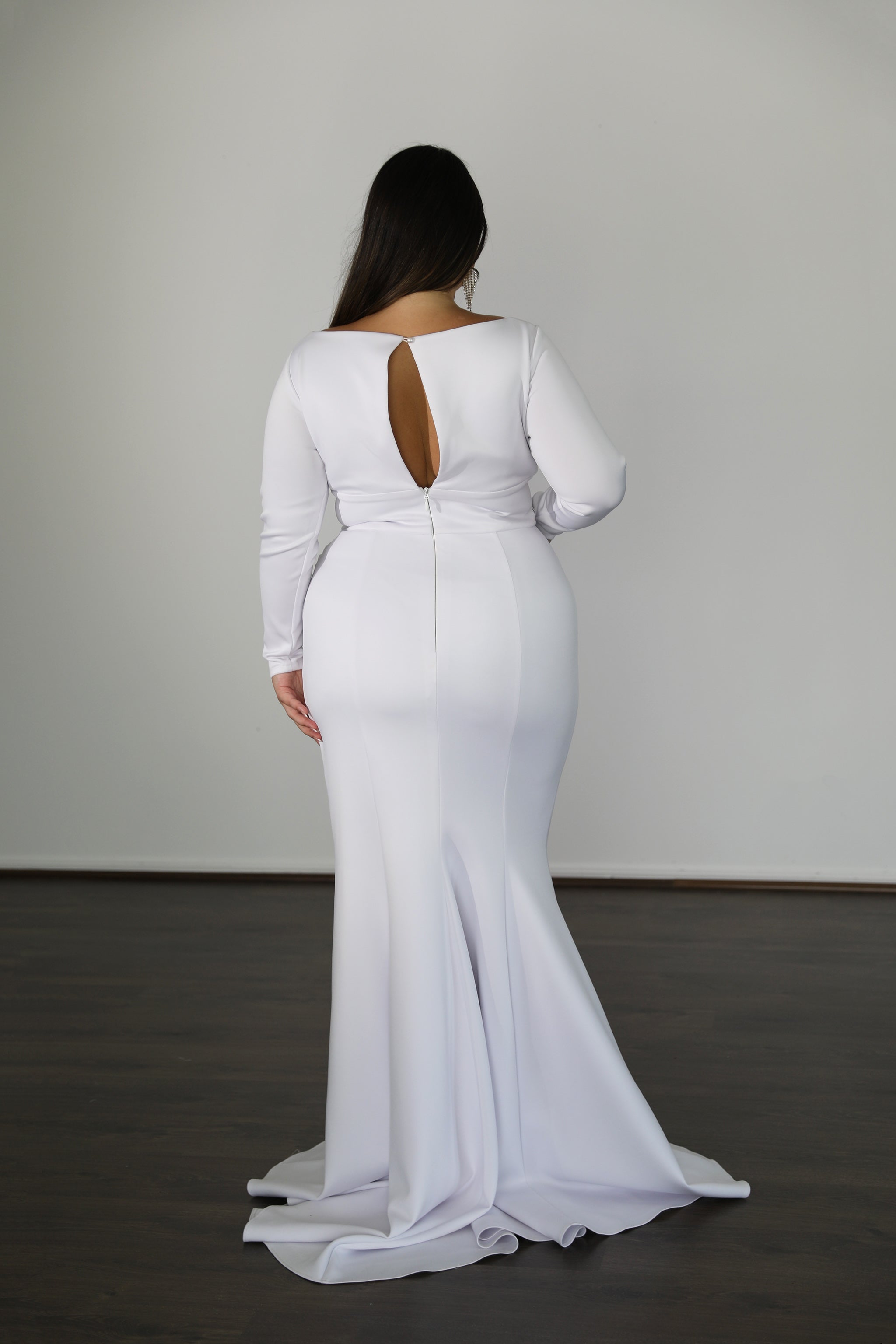 white formal dress with keyhole back cut out and long sleeves