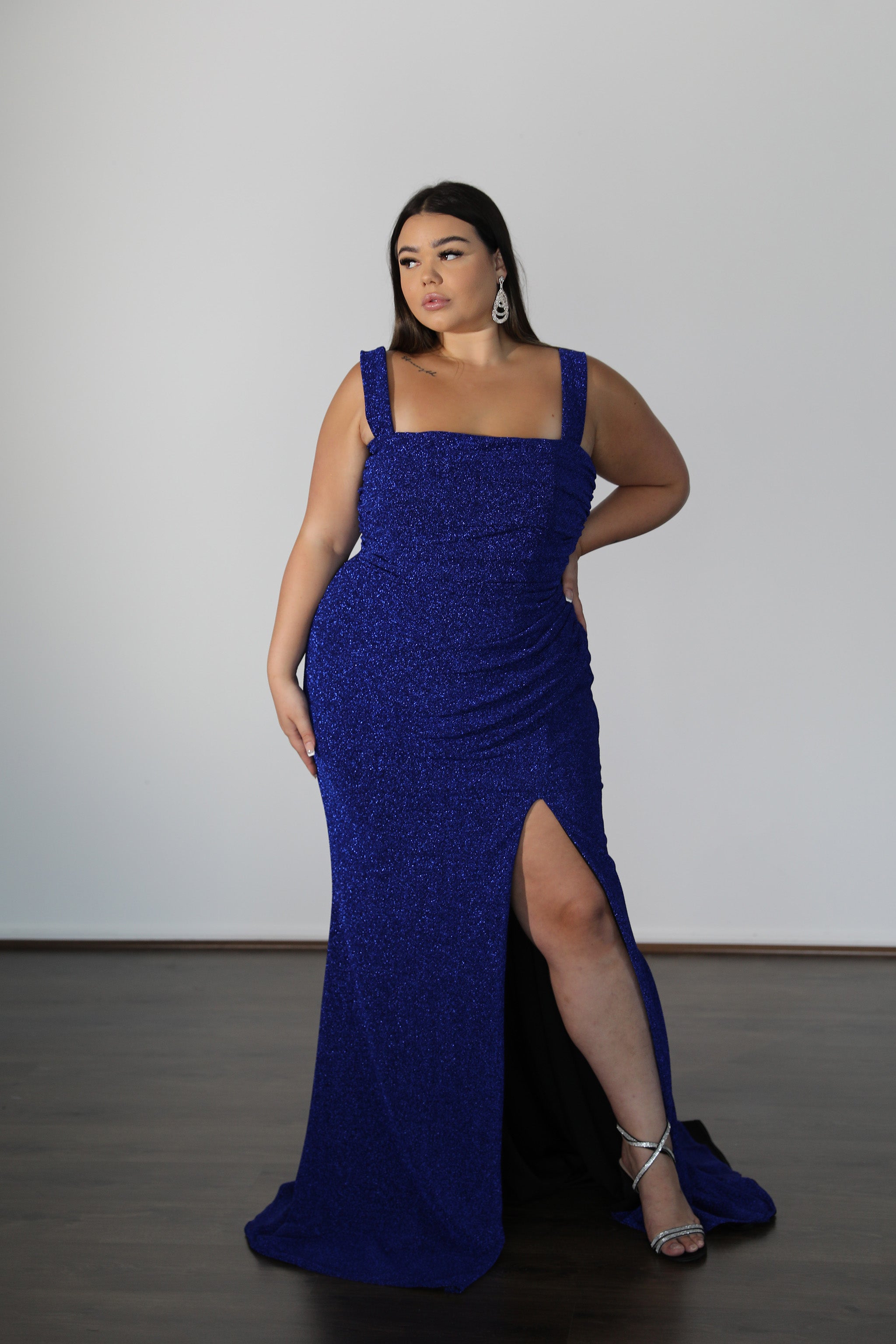 woman in blue formal gown with dramatic thigh slit